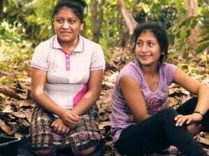 Beneficiaries siting in the cacao forest